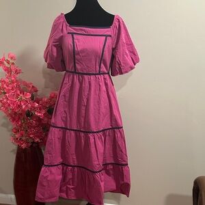 Elegant Pink Dress with Black Trim